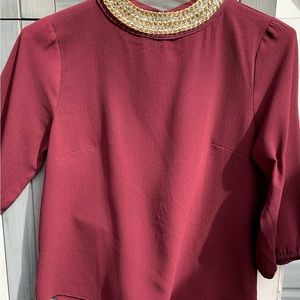 Burgundy blouse with jeweled neckline
